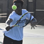 Player keeps eye on tennis ball